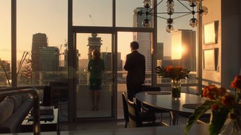 Movie still from “Roman J. Israel, Esq.” (2017), directed by Dan Gilroy – A man and a woman standing in front of an open glass door; Wide shot, High angle