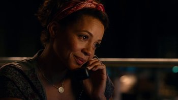 Movie still from “Roman J. Israel, Esq.” (2017), directed by Dan Gilroy – A woman talking on a phone while sitting down; Close Up shot, Low angle