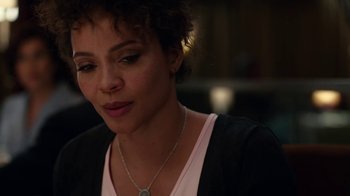 Movie still from “Roman J. Israel, Esq.” (2017), directed by Dan Gilroy – A person wearing a necklace; Close Up shot, Over the shoulder angle