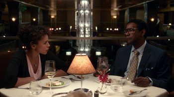 Movie still from “Roman J. Israel, Esq.” (2017), directed by Dan Gilroy – A man and a woman sitting at a dinner table; Medium shot, Over the shoulder angle