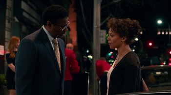 Movie still from “Roman J. Israel, Esq.” (2017), directed by Dan Gilroy – A man and a woman are standing next to each other on the street; Medium shot, Over the shoulder angle