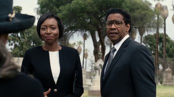 Movie still from “Roman J. Israel, Esq.” (2017), directed by Dan Gilroy – A man and a woman standing next to each other; Medium shot, Over the shoulder angle