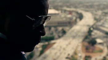 Movie still from “Roman J. Israel, Esq.” (2017), directed by Dan Gilroy – A person wearing glasses looking out a window; Close Up shot, Over the shoulder angle