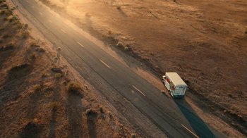 Movie still from “Roman J. Israel, Esq.” (2017), directed by Dan Gilroy – An aerial view of a bus driving down the road; Extreme Wide shot, High angle