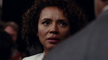 Movie still from “Roman J. Israel, Esq.” (2017), directed by Dan Gilroy – A person with curly brown hair; Close Up shot, Over the shoulder angle