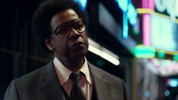 Movie still from “Roman J. Israel, Esq.” (2017), directed by Dan Gilroy – A man in a suit and tie wearing glasses; Close Up shot, Low angle