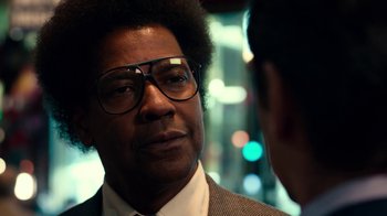 Movie still from “Roman J. Israel, Esq.” (2017), directed by Dan Gilroy – A person wearing a suit and glasses; Close Up shot, Over the shoulder angle