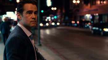 Movie still from “Roman J. Israel, Esq.” (2017), directed by Dan Gilroy – A man standing on a street corner at night; Close Up shot, Over the shoulder angle