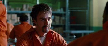 Movie still from “Rounders” (1998), directed by John Dahl – A person wearing an orange jacket; Close Up shot, Over the shoulder angle