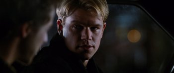 Movie still from “Rounders” (1998), directed by John Dahl – A person with blond hair; Close Up shot, Over the shoulder angle