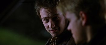 Movie still from “Rounders” (1998), directed by John Dahl – A person looking at the camera; Close Up shot, Over the shoulder angle
