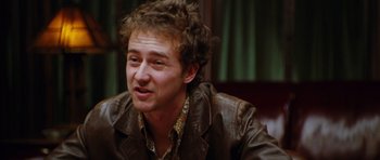 Movie still from “Rounders” (1998), directed by John Dahl – A person wearing a leather jacket; Close Up shot, Over the shoulder angle