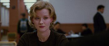 Movie still from “Rounders” (1998), directed by John Dahl – A person with short hair; Close Up shot, Over the shoulder angle