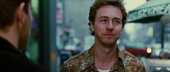 Movie still from “Rounders” (1998), directed by John Dahl – A person wearing a floral shirt; Close Up shot, Over the shoulder angle
