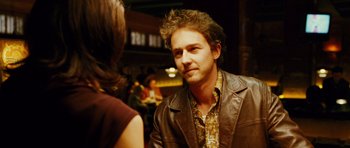 Movie still from “Rounders” (1998), directed by John Dahl – A man and a woman are sitting at a table; Close Up shot, Over the shoulder angle