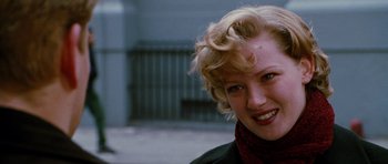 Movie still from “Rounders” (1998), directed by John Dahl – A person with blonde hair; Close Up shot, Over the shoulder angle