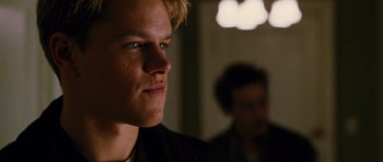 Movie still from “Rounders” (1998), directed by John Dahl – A man's face in a dark room; Close Up shot, Low angle