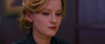 Movie still from “Rounders” (1998), directed by John Dahl – A person with blonde hair; Close Up shot, Over the shoulder angle