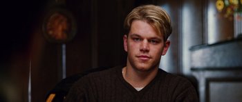 Movie still from “Rounders” (1998), directed by John Dahl – A person wearing a brown sweater; Close Up shot, Over the shoulder angle