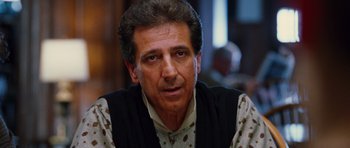 Movie still from “Rounders” (1998), directed by John Dahl – A person wearing a shirt and vest; Close Up shot, Over the shoulder angle