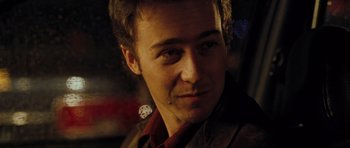 Movie still from “Rounders” (1998), directed by John Dahl – A person wearing a suit and tie; Close Up shot, Over the shoulder angle