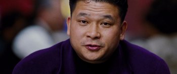 Movie still from “Rounders” (1998), directed by John Dahl – A person wearing a purple shirt; Close Up shot, Low angle