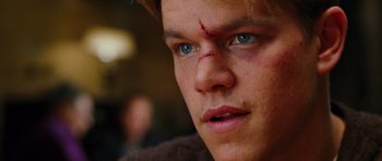 Movie still from “Rounders” (1998), directed by John Dahl – A young man's face with blood on his face; Close Up shot, Over the shoulder angle