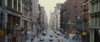 Movie still from “Rounders” (1998), directed by John Dahl – A city street filled with lots of traffic; Extreme Wide shot, High angle
