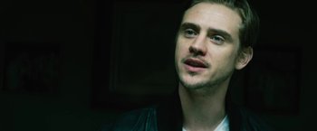 Movie still from “Run All Night” (2015), directed by Jaume Collet-Serra – A person wearing a leather jacket; Close Up shot, Low angle