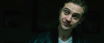 Movie still from “Run All Night” (2015), directed by Jaume Collet-Serra – A person wearing a leather jacket; Close Up shot, Low angle