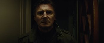 Movie still from “Run All Night” (2015), directed by Jaume Collet-Serra – A person wearing a jacket; Close Up shot, Low angle