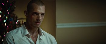 Movie still from “Run All Night” (2015), directed by Jaume Collet-Serra – A person wearing a white shirt with blood on his face; Close Up shot, Low angle