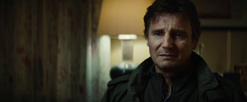 Movie still from “Run All Night” (2015), directed by Jaume Collet-Serra – A person wearing a jacket; Close Up shot, Over the shoulder angle