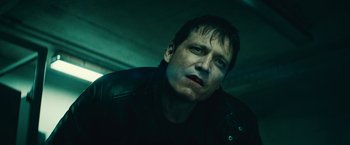 Movie still from “Run All Night” (2015), directed by Jaume Collet-Serra – A person wearing a black jacket; Close Up shot, Low angle