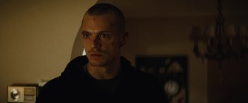 Movie still from “Run All Night” (2015), directed by Jaume Collet-Serra – A person wearing a black shirt; Close Up shot, Low angle