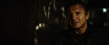 Movie still from “Run All Night” (2015), directed by Jaume Collet-Serra – A person wearing a black jacket; Close Up shot, Low angle