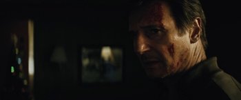 Movie still from “Run All Night” (2015), directed by Jaume Collet-Serra – A person with blood all over his face; Close Up shot, Over the shoulder angle