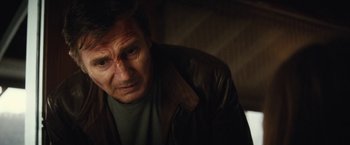 Movie still from “Run All Night” (2015), directed by Jaume Collet-Serra – A person wearing a leather jacket; Close Up shot, Low angle