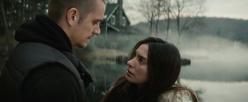 Movie still from “Run All Night” (2015), directed by Jaume Collet-Serra – A man and a woman looking at one another; Close Up shot, Low angle