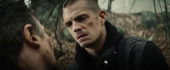 Movie still from “Run All Night” (2015), directed by Jaume Collet-Serra – A person wearing a black jacket; Close Up shot, Over the shoulder angle