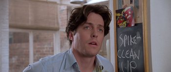 Movie still from “Notting Hill” (1999), directed by Roger Michell – A person looking at the camera; Close Up shot, Low angle