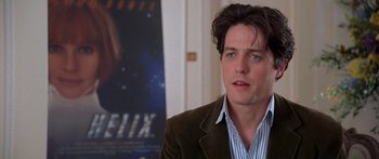 Movie still from “Notting Hill” (1999), directed by Roger Michell – A person wearing a jacket; Close Up shot, Over the shoulder angle