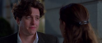 Movie still from “Notting Hill” (1999), directed by Roger Michell – A person talking to another person; Close Up shot, Over the shoulder angle