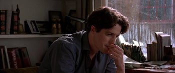 Movie still from “Notting Hill” (1999), directed by Roger Michell – A person sitting in front of a window; Close Up shot, Over the shoulder angle