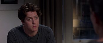 Movie still from “Notting Hill” (1999), directed by Roger Michell – A person sitting in front of a window; Close Up shot, Over the shoulder angle