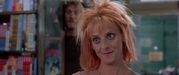 Movie still from “Notting Hill” (1999), directed by Roger Michell – A person with pink hair; Close Up shot, Over the shoulder angle