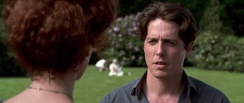 Movie still from “Notting Hill” (1999), directed by Roger Michell – Two people are talking to each other in a park; Close Up shot, Over the shoulder angle