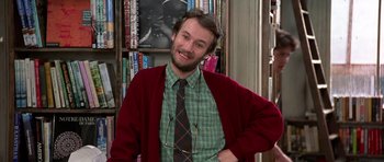 Movie still from “Notting Hill” (1999), directed by Roger Michell – A man in a green shirt and a red cardigan; Medium shot, Low angle