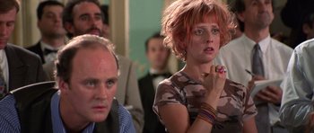 Movie still from “Notting Hill” (1999), directed by Roger Michell – A woman with red hair is standing next to a man; Close Up shot, Over the shoulder angle