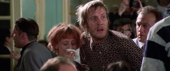 Movie still from “Notting Hill” (1999), directed by Roger Michell – A man and a woman are standing in front of each other; Medium shot, Over the shoulder angle